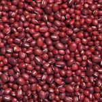 red round fruits on white surface